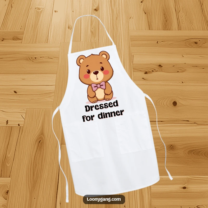 Funny bear cub apron showing a cute brown bear with a hilariously crooked bowtie, perfect for a fun cooking experience.