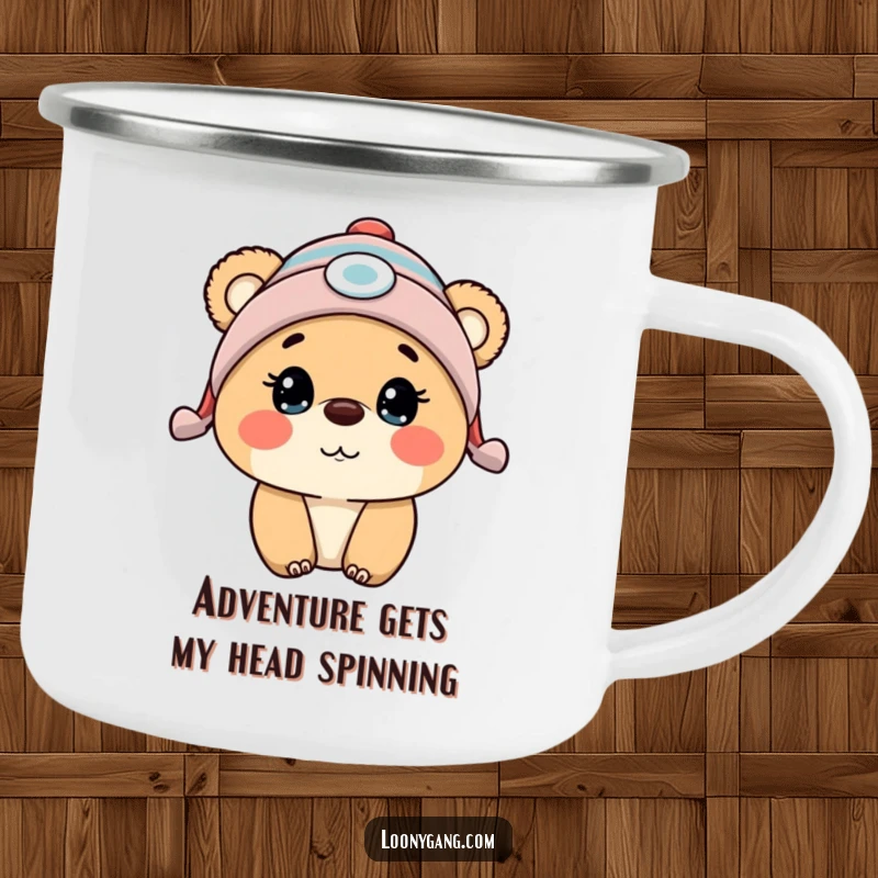 Funny bear cub wearing a propeller beanie, looking surprised, on a sturdy camping mug for outdoor fun.