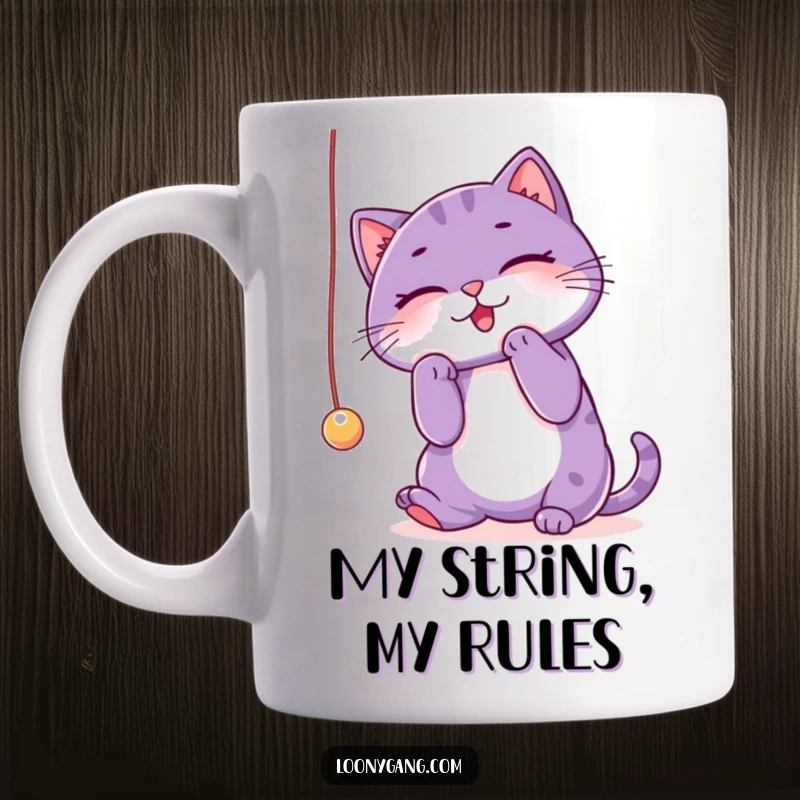 Funny purple cat mug showing a playful kitty batting at a dangling string with sheer delight and mischief. A humorous gift.