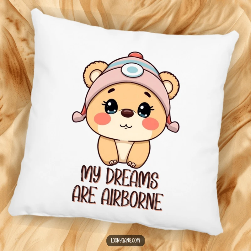 Funny bear cub wearing a propeller beanie, expressing comical surprise, printed on a soft and inviting pillow.