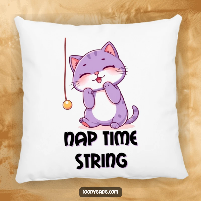 Funny purple cat pillow showcasing a cat’s gleeful obsession with a dangling string, perfect for a cozy and humorous touch. Home decor.