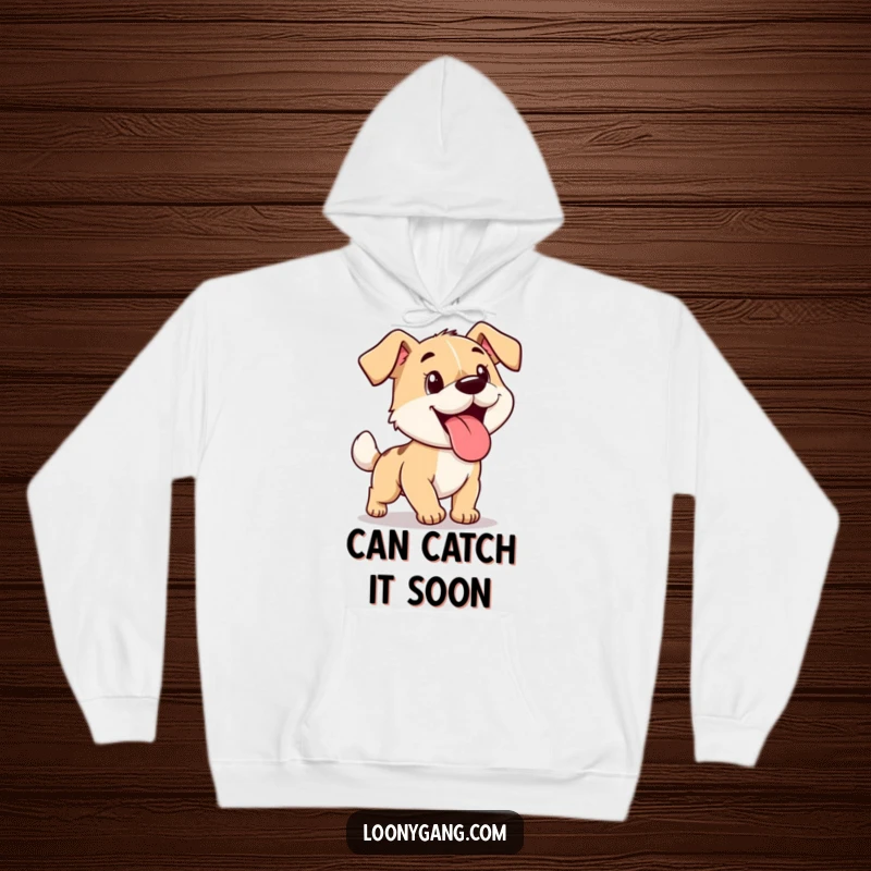 Funny cartoon dog with its tongue lolling out, chasing its tail in circles, featured on a comfortable hoodie.