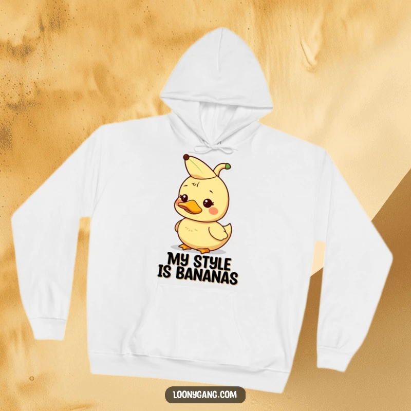 Funny dorky duckling with a banana peel on its head, cozy hoodie, silly animal.