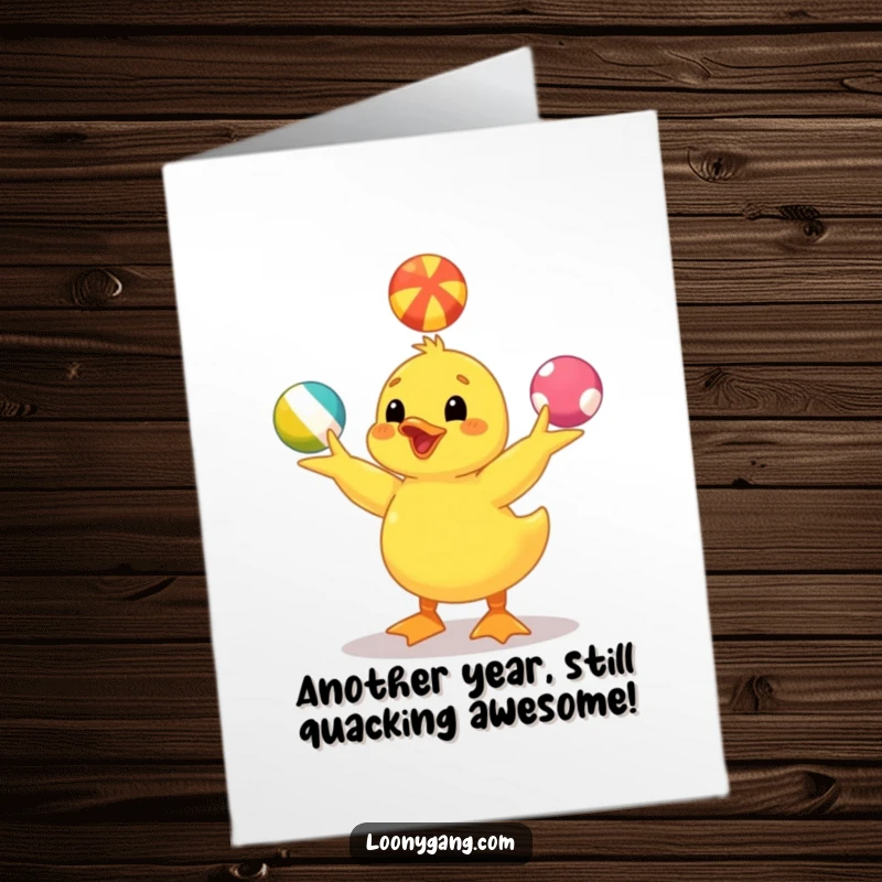 Funny Free Printable Birthday Card: Happy yellow duckling expertly juggling three colorful balls, celebrating.