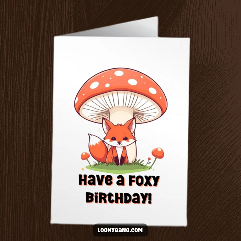 Funny free printable birthday card showing a red fox peeking from behind a giant, comical mushroom. A downloadable forest surprise!