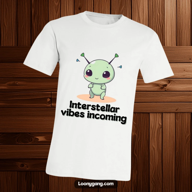 Funny alien t-shirt showcasing a small, round creature with excited eyes, spinning its antennae with chaotic glee.