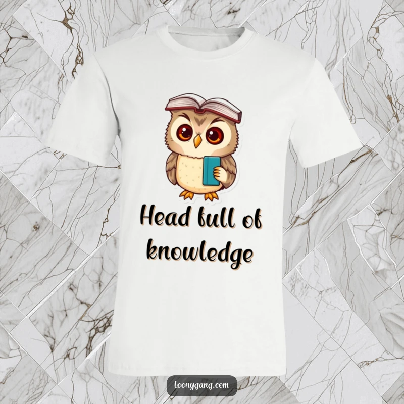 A comical t-shirt featuring a funny owl cub with big, confused eyes, a book balanced on its head, looking perplexed.