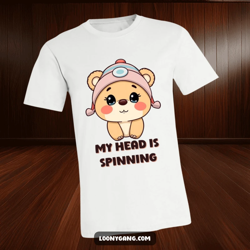 Funny bear cub wearing a propeller beanie, wide-eyed with surprise, printed on a comfortable t-shirt.