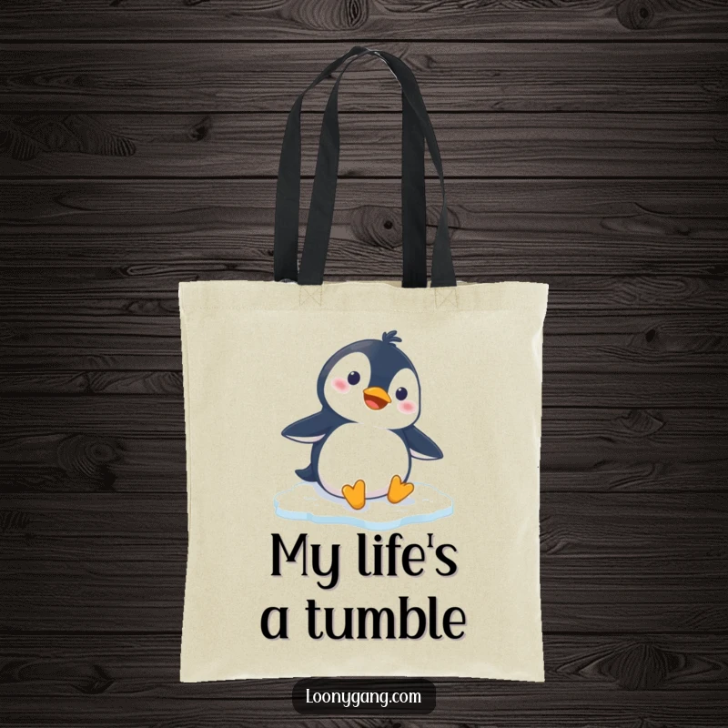Funny penguin tote bag with a cartoon penguin slipping comically on ice, ideal for stylish and humorous everyday carrying.